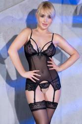 Tulle and lace guepiere with thong and stockings. Black