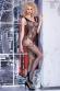 Catsuit in rete e pizzo effetto guepiere con calze.