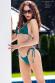 Mini bikini verde 3 pezzi con tanga e perizoma.